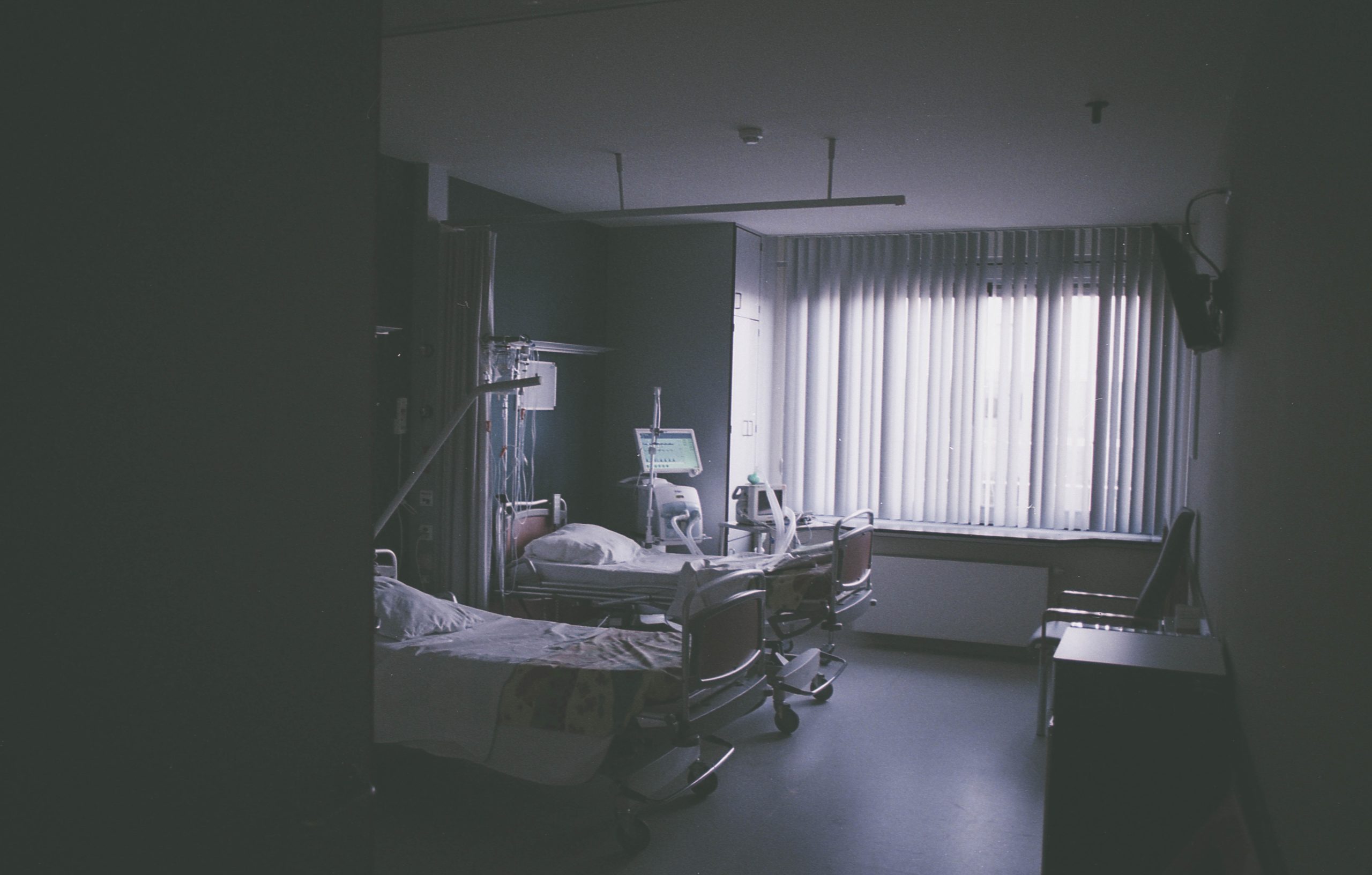 grayscale photography of nursing bed